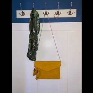 Yellow faux leather purse with tassel detail